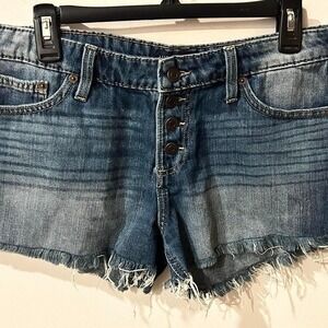Lucky Brand blue denim cut off shorts with button fly and frayed hem. Size: 6